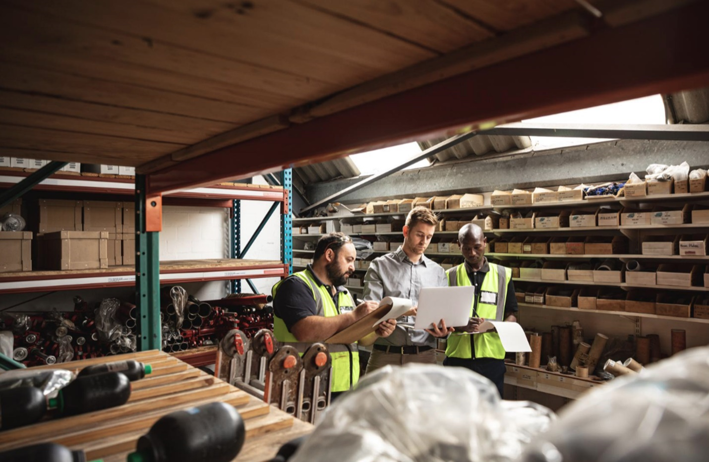 Input Image Showing Three People in a Warehouse Environment